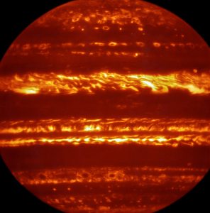 In preparation for the imminent arrival of NASA’s Juno spacecraft in July 2016, astronomers used ESO’s Very Large Telescope to obtain spectacular new infrared images of Jupiter using the VISIR instrument. They are part of a campaign to create high-resolution maps of the giant planet to inform the work to be undertaken by Juno over the following months, helping astronomers to better understand the gas giant. This false-colour image was created by selecting and combining the best images obtained from many short VISIR exposures at a wavelength of 5 micrometres. Credit: ESO/L. Fletcher