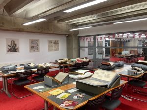 Books and manuscripts laid out on the reading room desks.