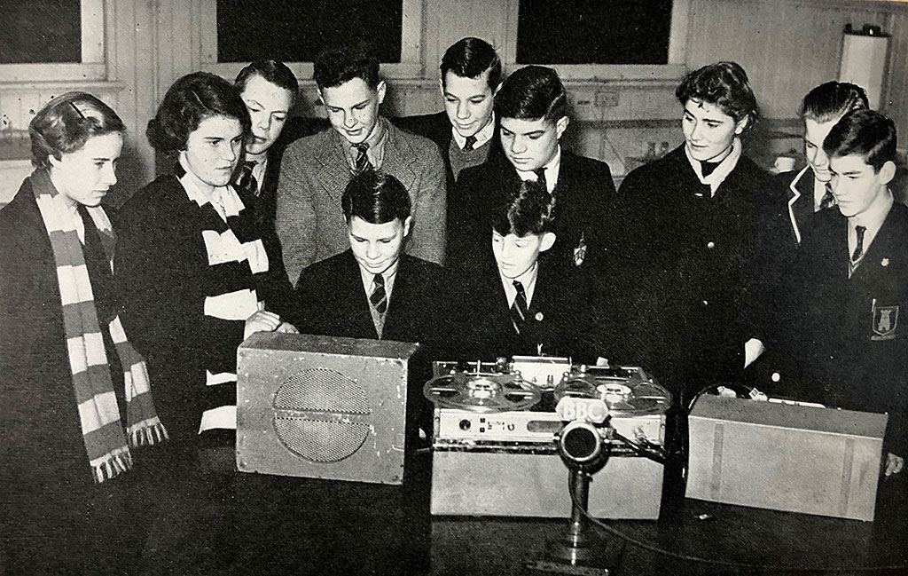 Photo of children in museum with BBC tape recorder and microphone