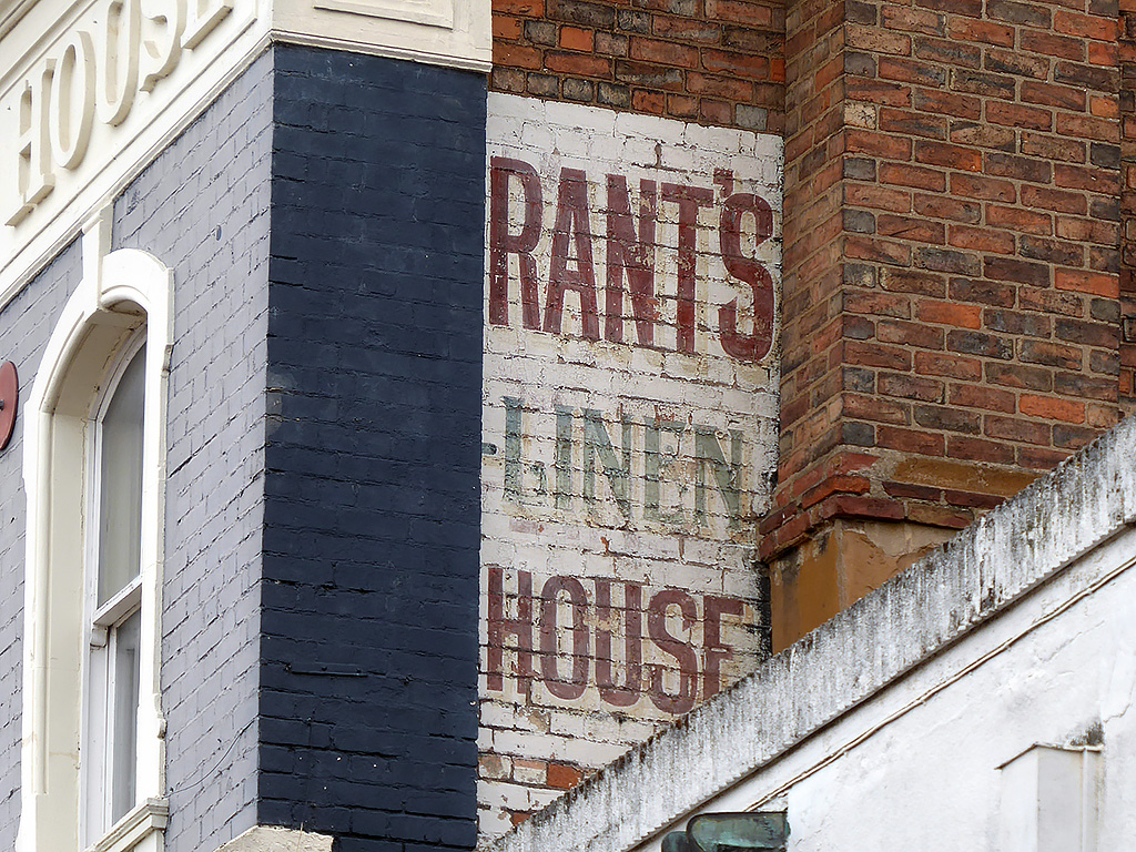 Photo of painted advertisement for Rant's linen house.