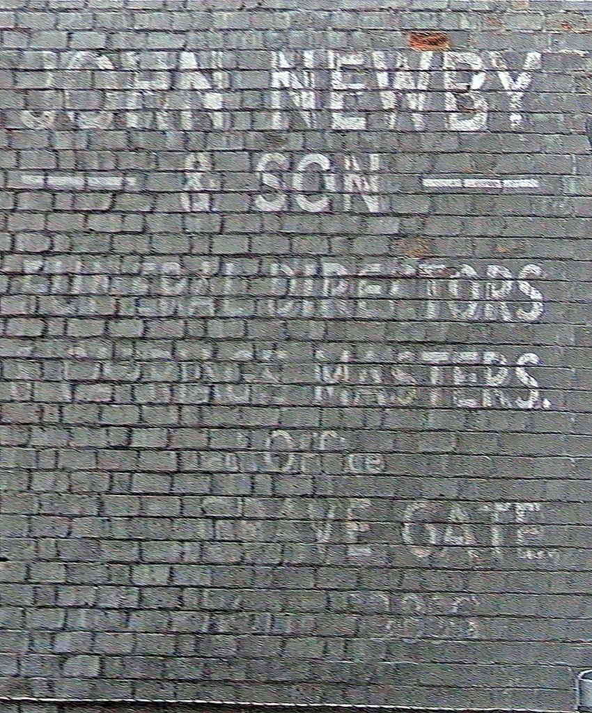 Photo of painted advertisement for John Newby, funeral directors.