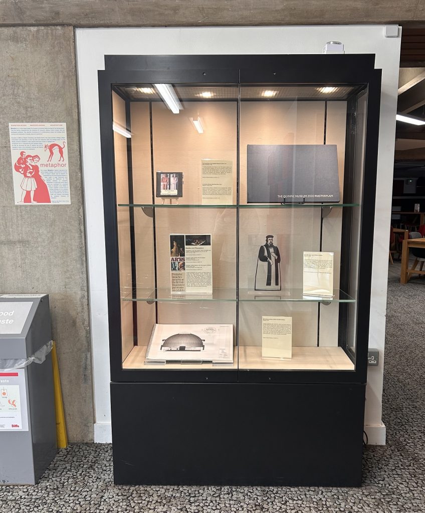 Display in case, with poster attached next to it