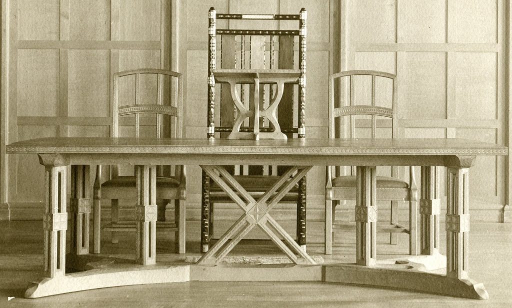 Black and white photograph of the wooden 'Cholerton' chair and a table and 2 chairs made by Ernest Gimson. These were gifts made to University College, Leicester. 