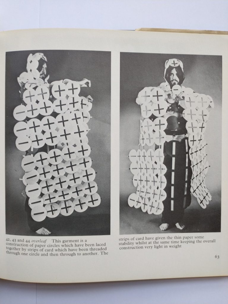 Image of man in paper plate type costume