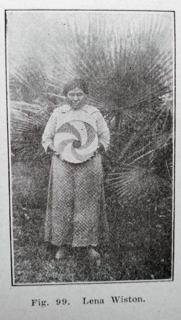 Photo from The Pima book of Lena Wiston holding one of her baskets