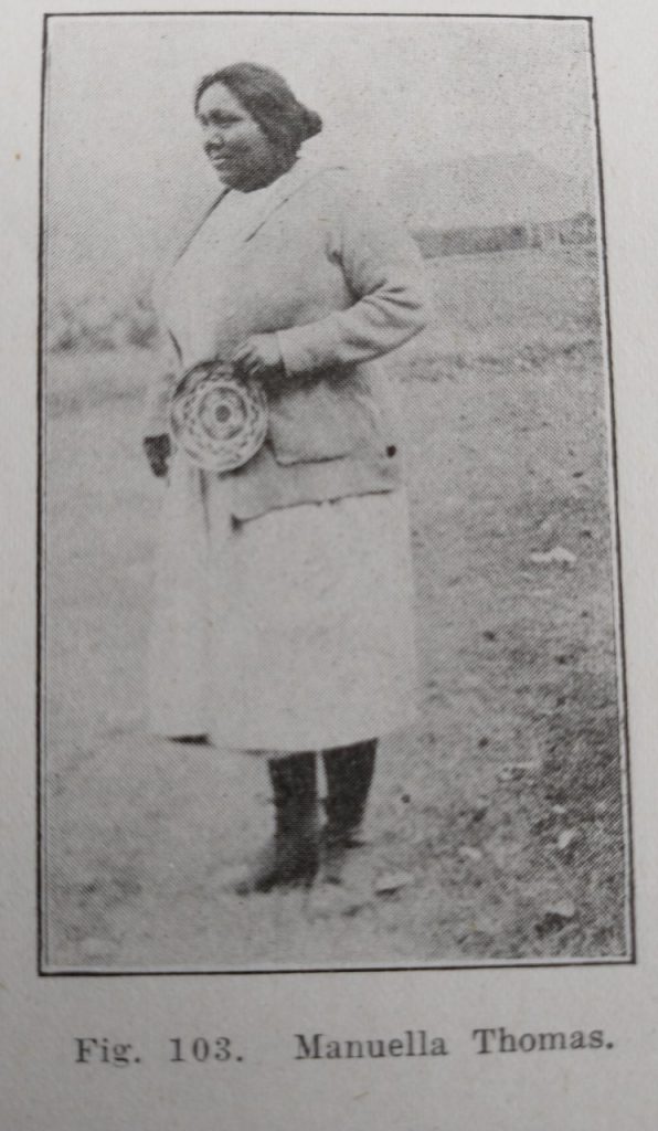 Photo from the Pima book of Manuella Thomas holding one of her baskets